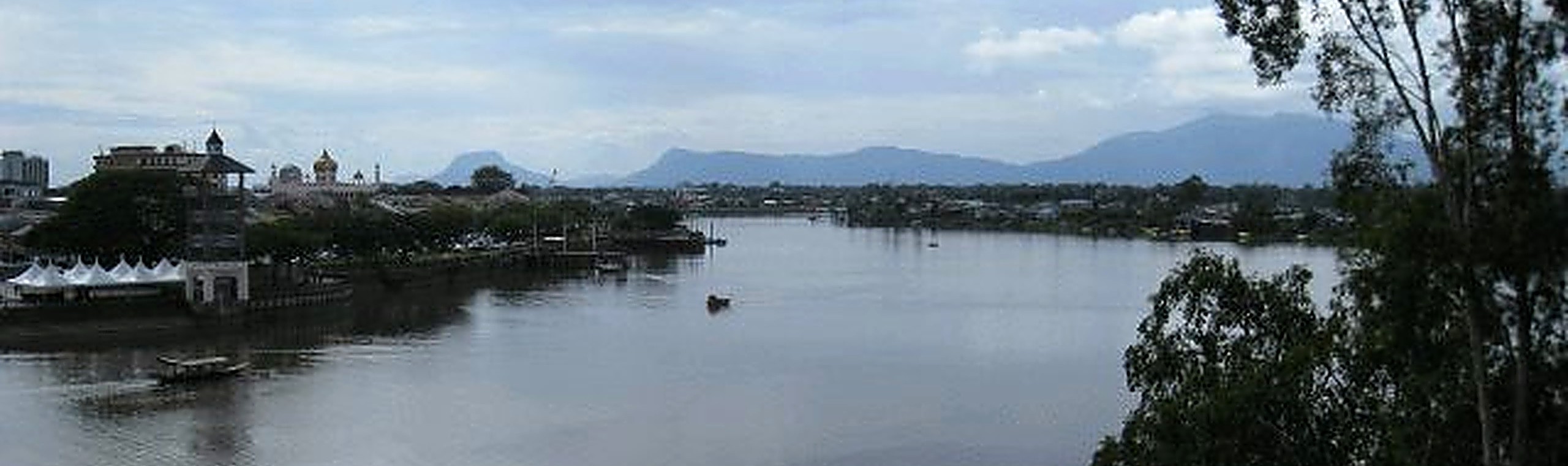 The Kanowit river, with the town and the blue hills beyond